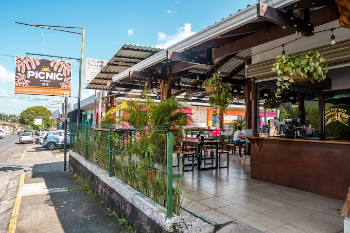 Picnic Restaurant streetside exterior in downtown La Fortuna with covered patio seating.